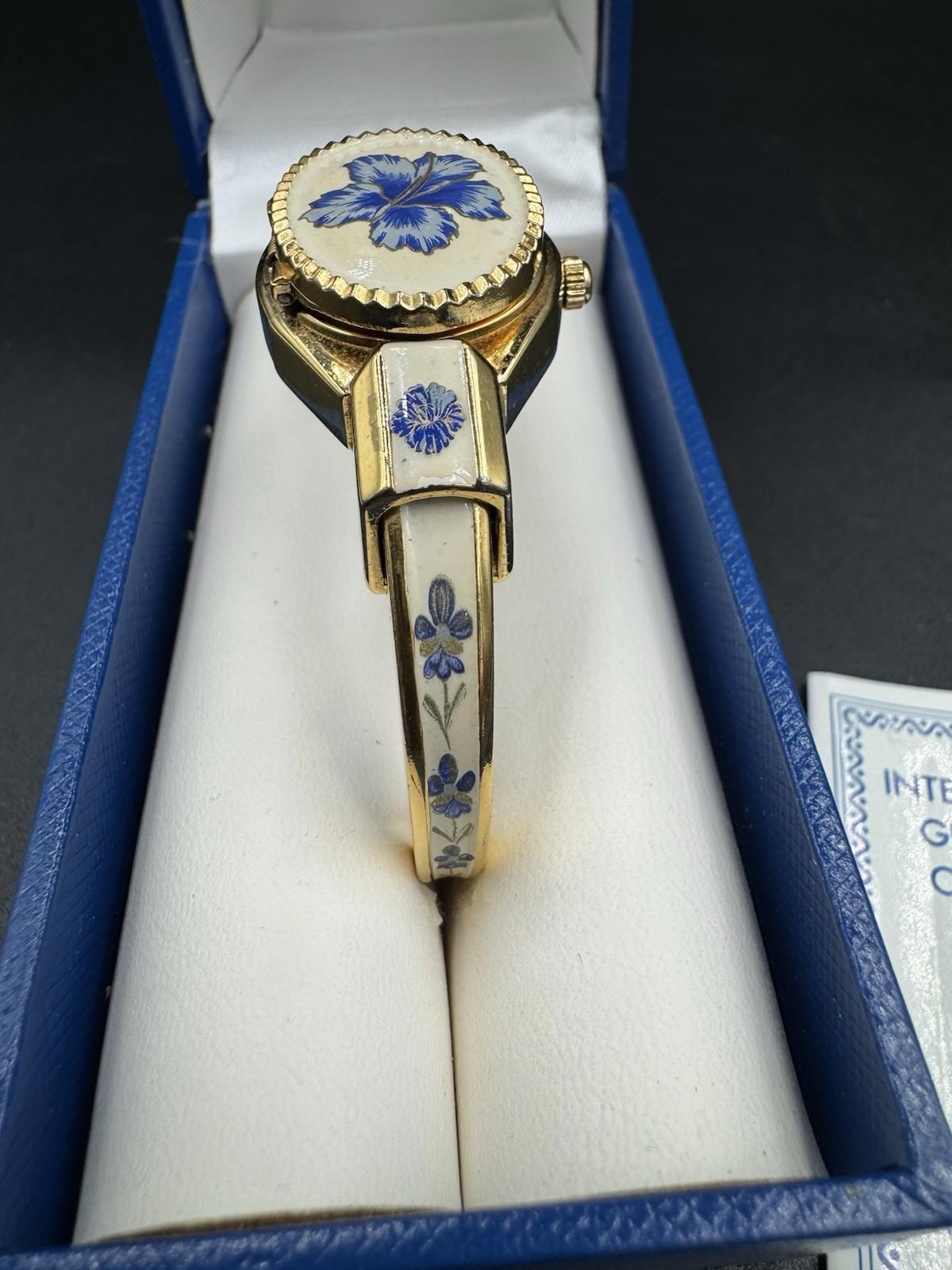 Vintage Andre Mouche Gold Tone Peekaboo Watch White Enamel Blue Flowers with box