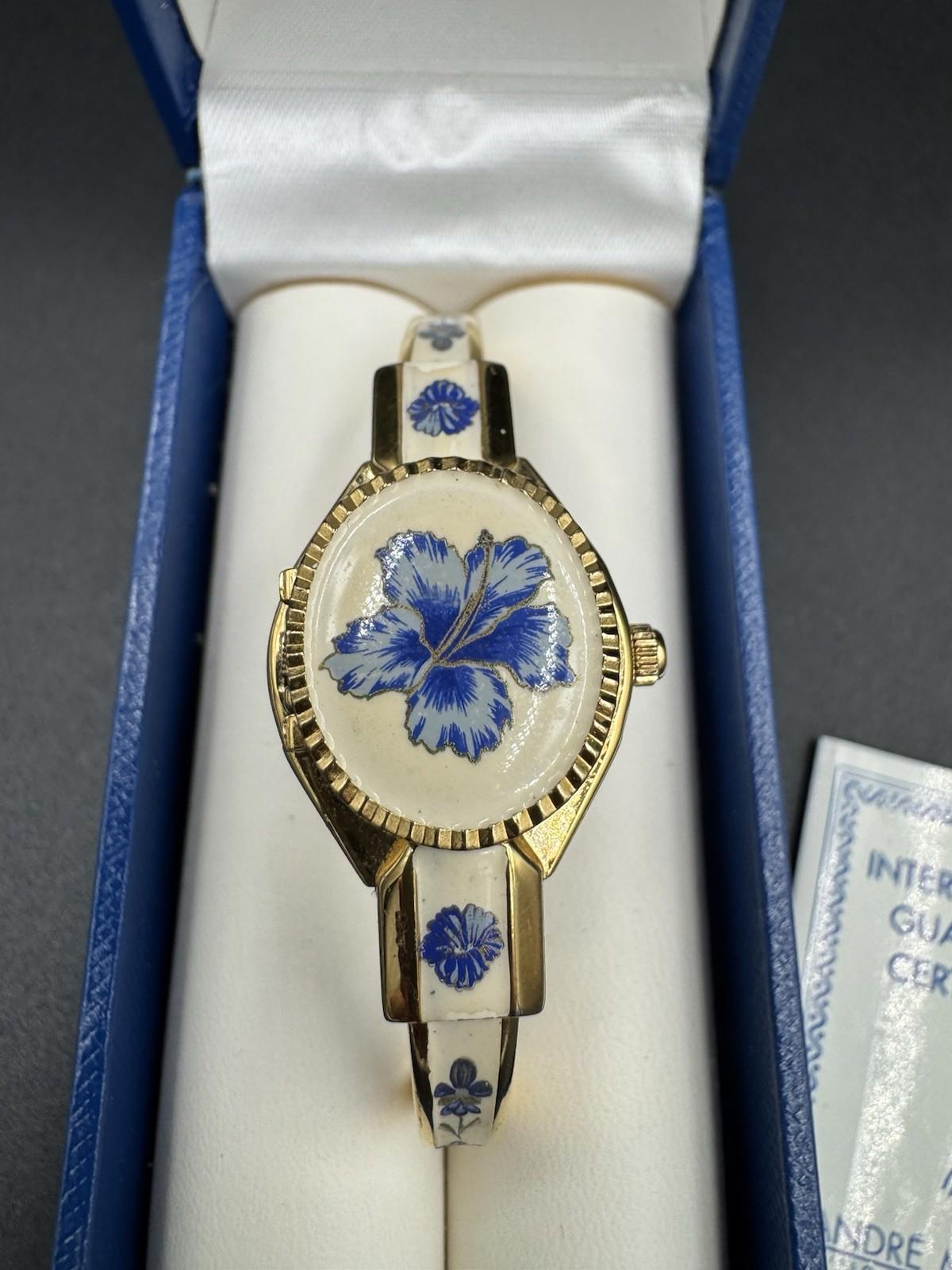 Vintage Andre Mouche Gold Tone Peekaboo Watch White Enamel Blue Flowers with box